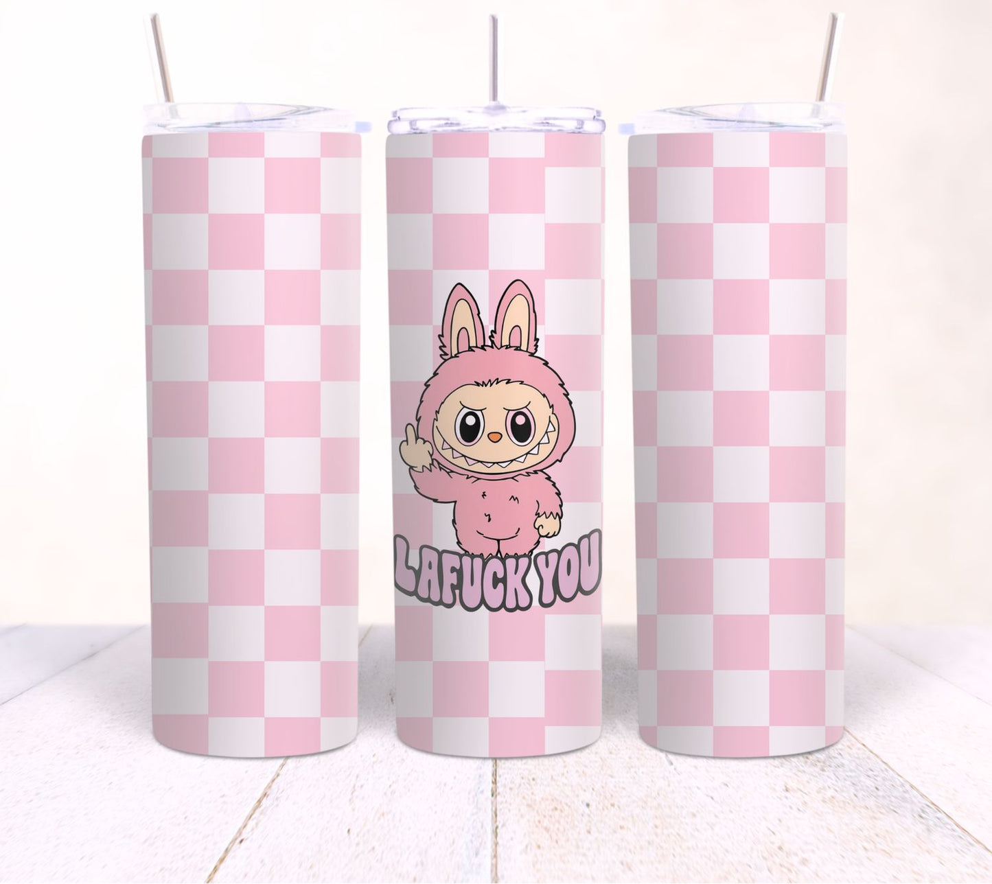 Three pink and white checkered tumblers with a cartoon character and text on a white background